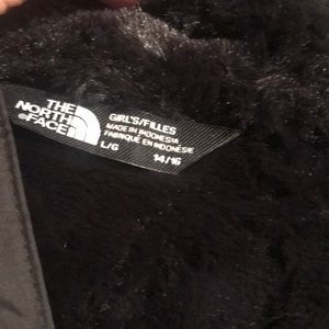 Girls black Mossbud Northface jacket.